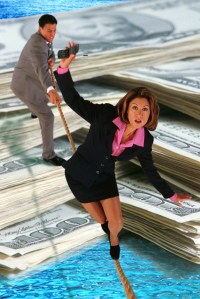 Businesswomen Balancing Over Money
