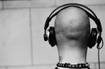 Bald Man Wearing Headphones