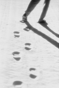 Legs Leaving Shoe Prints in the Sand